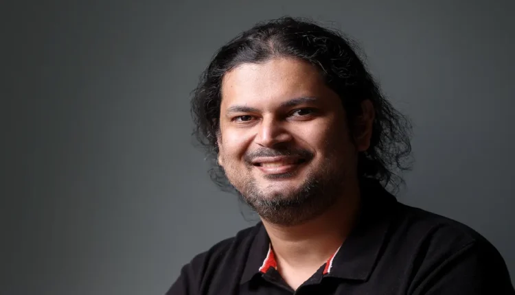 NRI Today - Amrit Acharya: A Journey to the Pinnacle